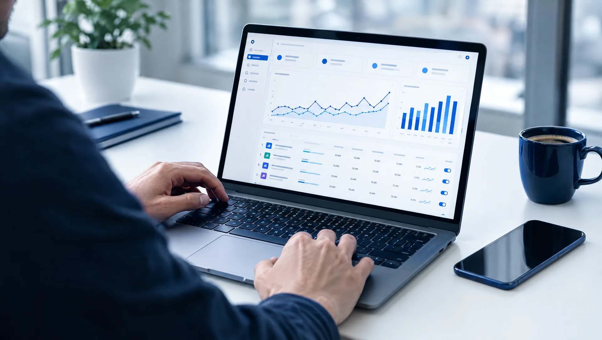 Media buyer reviewing an advertising analytics dashboard on a laptop